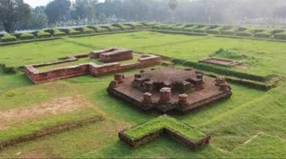 Cross-shaped central shrine and monastery walls at Ananda Vihara