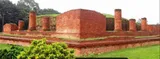 Brick walls and pillar bases at Ananda Vihara