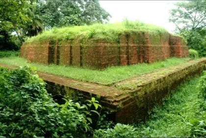 Grass-covered brick walls of Charpatra Mura