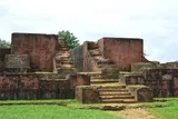 Brick ruins of Itakhola Mura rising in terraces