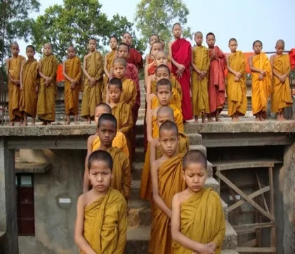 A group of young novice monks standing together