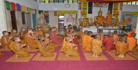 Novice monks seated in the prayer hall