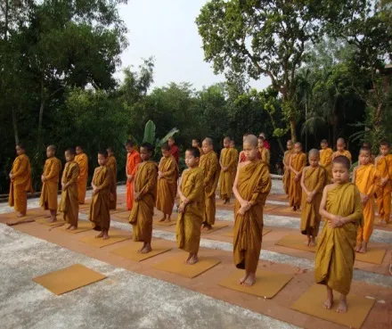 Novices standing in rows during walking meditation