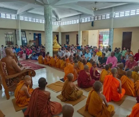 Monks and devotees gathered in the prayer hall