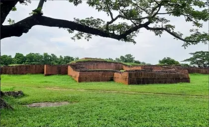The site of Queen Mainamati's palace framed by trees