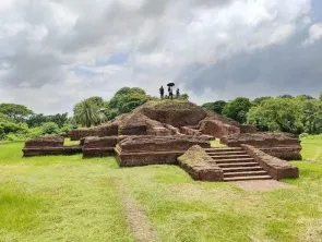 Terraced brick ruins under a cloudy sky