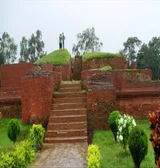 Brick stairway leading up to the ruins of Salban Vihara, with visitors at the top