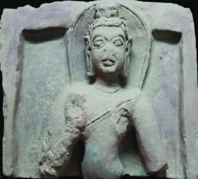 Weathered stone relief of the Buddha