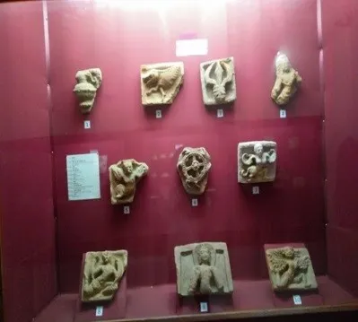 Terracotta plaques displayed in a museum case