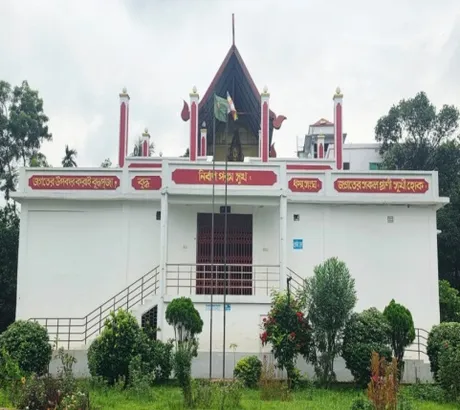 The white main building of New Salban Vihara with its red-trimmed gable