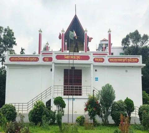 The white main building of New Salban Vihara with its red-trimmed gable
